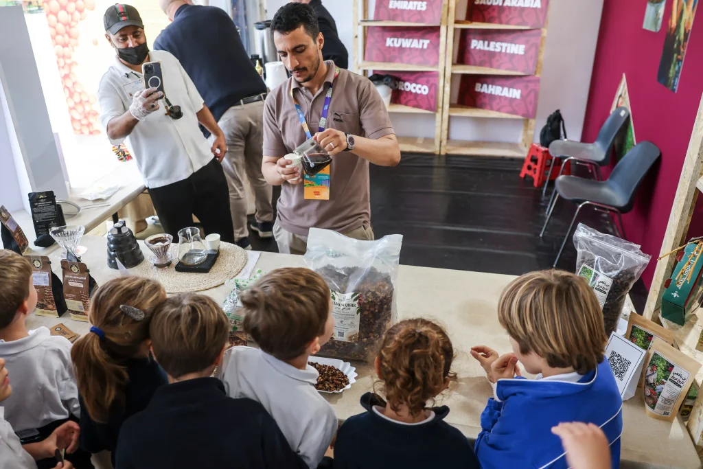 Young visitors learning about Yemeni coffee at the FAO Global Exhibition 2026 in Rome